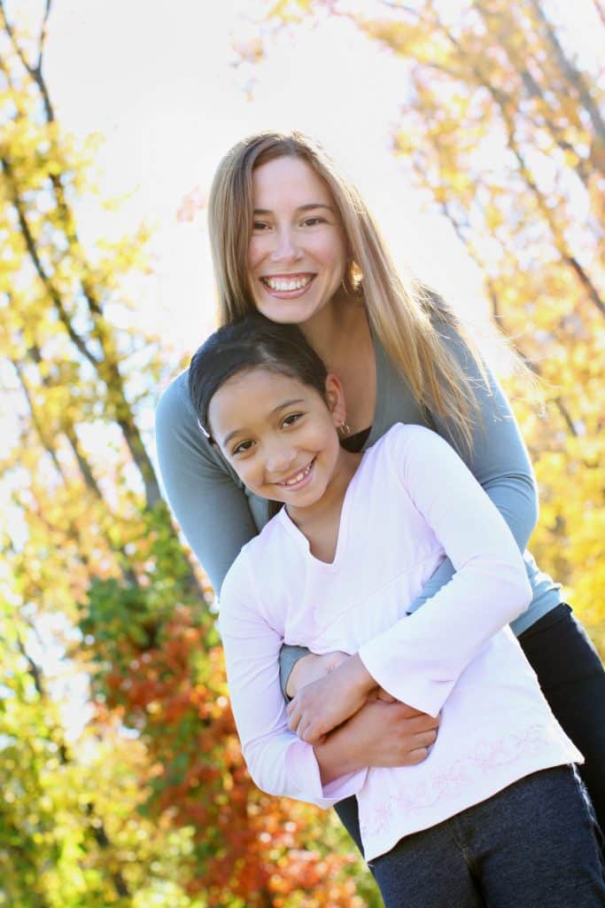 Mother and daughter in the forest