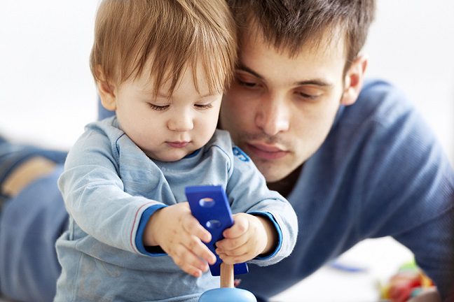 Father and son playing