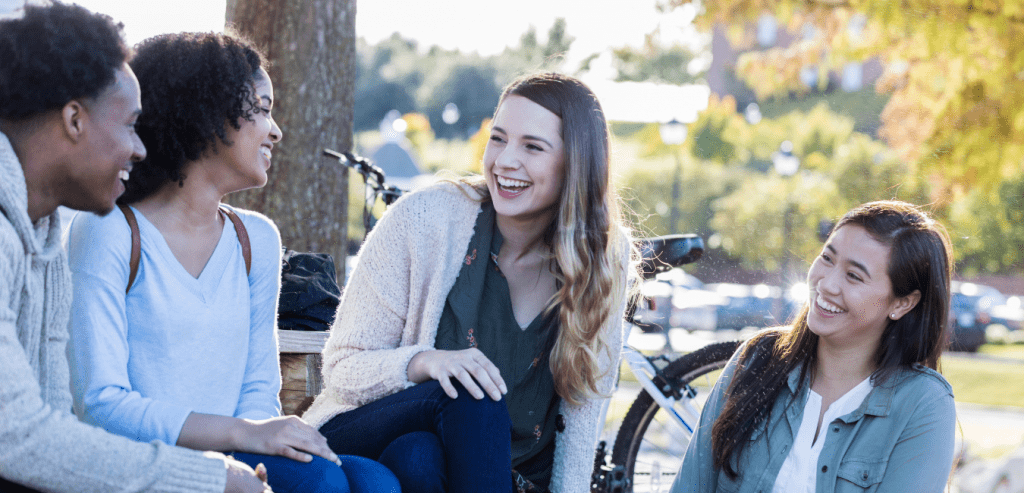 Group of young people chatting in the park